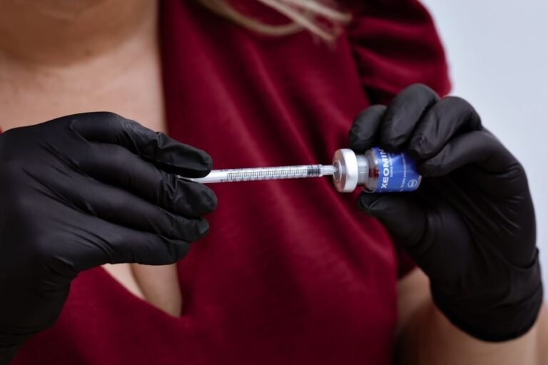 Professional administering Xeomin injection, emphasizing careful handling and precision.